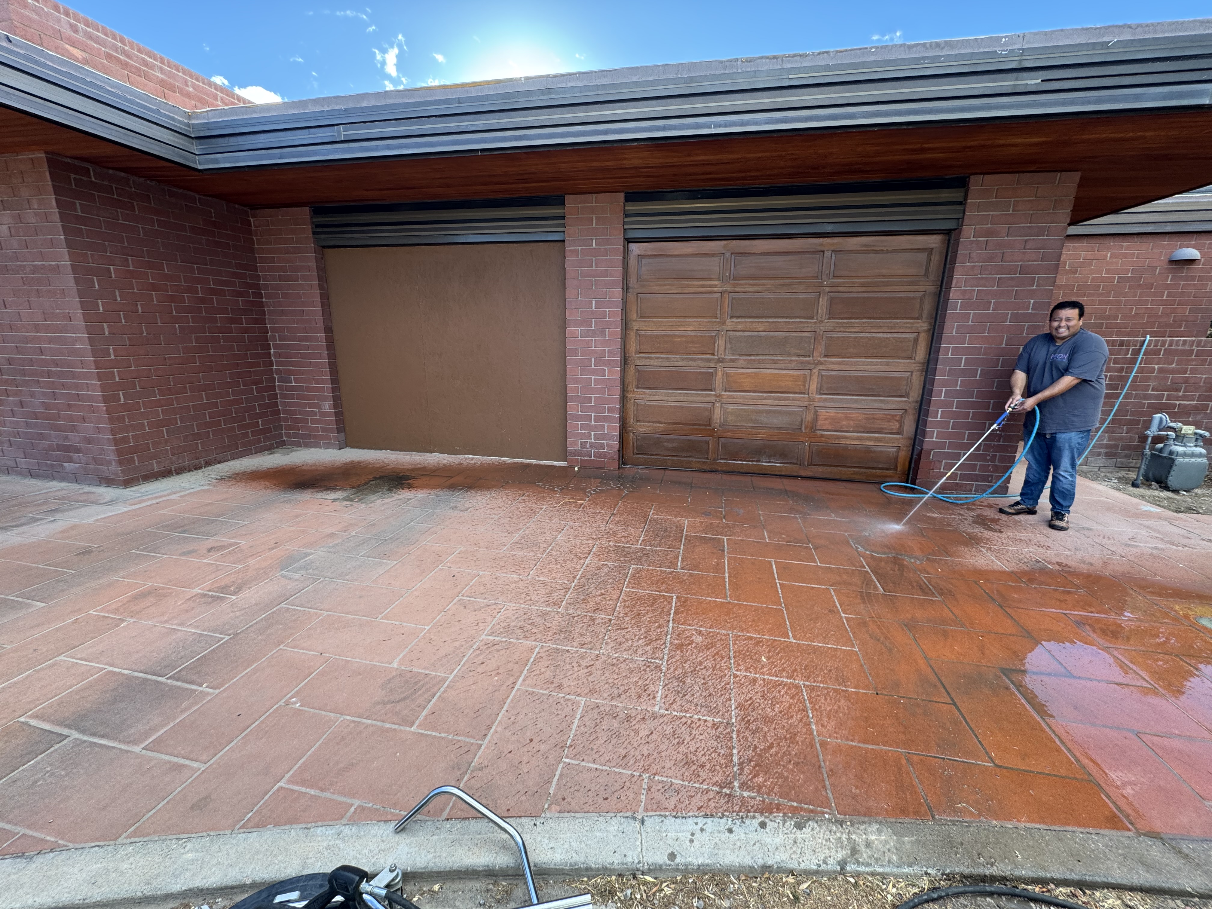 Paved stone tile driveway with accumulated dirt and grime buildup before professional pressure washing in Las Vegas